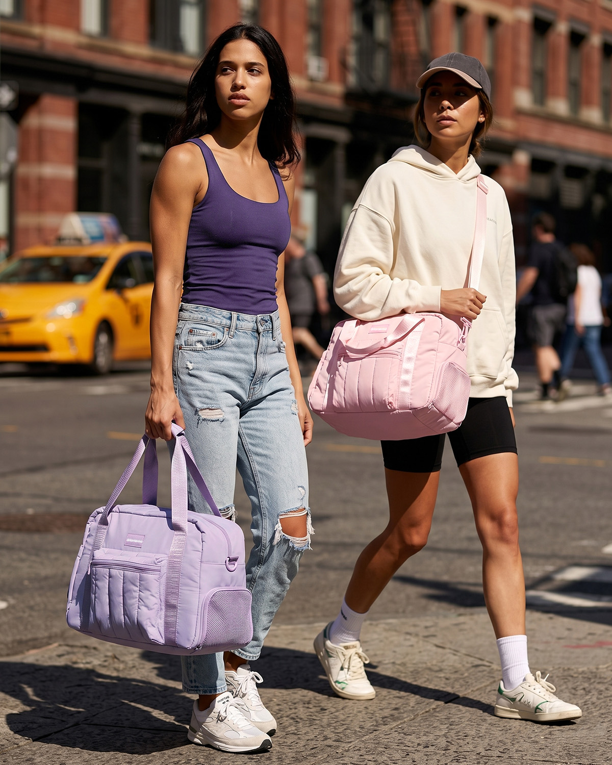 Models carrying pastel sport duffles
